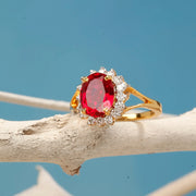 Gold Plated Oval Cut Ruby Red Stone Ring with American Diamond Halo Design